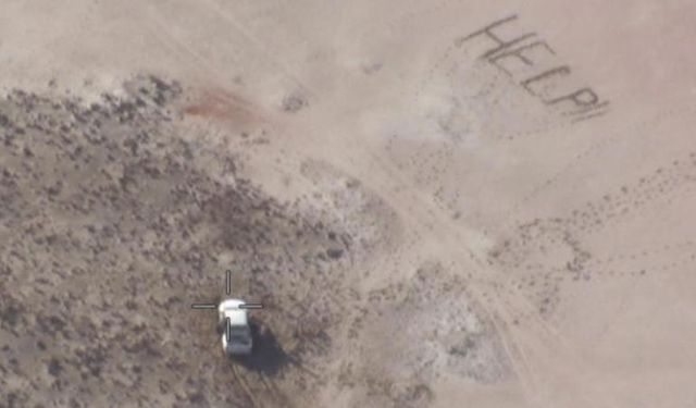 Young men rescued after writing "help" in the sand